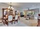 Open-concept living space combining dining area and living room with plenty of natural light at 144 Silver Falls, Apollo Beach, FL 33572