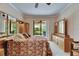 Main bedroom with a ceiling fan, light wood furniture, and sliding glass doors leading to a patio at 144 Silver Falls, Apollo Beach, FL 33572