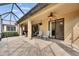 Enjoy your outdoor living area on this covered screened patio with a ceiling fan at 144 Silver Falls, Apollo Beach, FL 33572