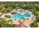 Aerial view of the community pool and surrounding landscaping at 144 Silver Falls, Apollo Beach, FL 33572