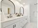 Modern bathroom featuring dual sinks, white quartz countertops, and stylish black fixtures at 15921 Wyndover Rd, Tampa, FL 33647