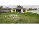 Expansive backyard offers a blank slate for landscaping and outdoor entertaining, with a home exterior view at 1610 Bondurant Way, Brandon, FL 33511