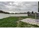 Spacious backyard includes a mix of grass and hardscape, ready for customization and leisure at 1610 Bondurant Way, Brandon, FL 33511