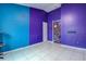 Unique bedroom featuring bright colored walls, tile floors and a painted door at 1610 Bondurant Way, Brandon, FL 33511