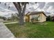 Single story home with a well-manicured lawn, mature trees, and a traditional-style facade at 1610 Bondurant Way, Brandon, FL 33511
