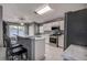 Stylish kitchen featuring modern appliances, marble counters, and breakfast bar seating at 1610 Bondurant Way, Brandon, FL 33511
