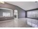 Open-concept living room with tile flooring, neutral walls, and plenty of natural light at 1610 Bondurant Way, Brandon, FL 33511