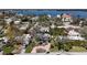 Aerial view of quiet neighborhood with mature trees and circular driveways that lead to cozy homes at 1859 Oklahoma Ne Ave, St Petersburg, FL 33703