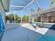Inviting covered patio area with comfortable seating, dining, and outdoor lighting for pleasant evenings outdoors at 1859 Oklahoma Ne Ave, St Petersburg, FL 33703