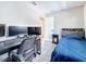Cozy bedroom featuring neutral walls, gaming setup, and comfortable sleeping arrangements at 1859 Oklahoma Ne Ave, St Petersburg, FL 33703