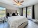 Bedroom features a large bed, a ceiling fan, and access to the backyard at 1859 Oklahoma Ne Ave, St Petersburg, FL 33703
