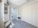 This room features white walls, gray flooring, and closet with white folding doors at 1859 Oklahoma Ne Ave, St Petersburg, FL 33703