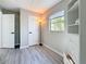 Comfortable bedroom with a window providing natural light, a wardrobe, and a convenient light for reading at 1859 Oklahoma Ne Ave, St Petersburg, FL 33703