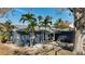 Exterior showcases a well-maintained single Gathering home with manicured landscaping and a welcoming front patio at 1859 Oklahoma Ne Ave, St Petersburg, FL 33703