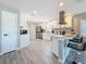 Bright, remodeled kitchen featuring white cabinets, stainless steel appliances, and a stylish breakfast bar at 1859 Oklahoma Ne Ave, St Petersburg, FL 33703