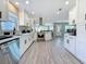 Updated kitchen featuring white cabinets, stainless steel appliances, and open layout at 1859 Oklahoma Ne Ave, St Petersburg, FL 33703