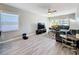 Living room showcases sleek flooring, modern ceiling fan, and comfortable seating area at 1859 Oklahoma Ne Ave, St Petersburg, FL 33703