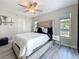 Comfortable main bedroom featuring neutral decor, stylish lighting, and ample natural light at 1859 Oklahoma Ne Ave, St Petersburg, FL 33703