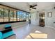 Sunroom providing natural light and a ceiling fan, offering a perfect space for relaxation and entertainment at 1859 Oklahoma Ne Ave, St Petersburg, FL 33703
