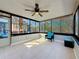 Sunroom providing a great space for relaxation and entertainment featuring natural light and a ceiling fan at 1859 Oklahoma Ne Ave, St Petersburg, FL 33703