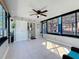 Sunroom filled with natural light and a ceiling fan, offering a great space for relaxation and entertainment at 1859 Oklahoma Ne Ave, St Petersburg, FL 33703