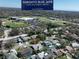 Aerial view of a home near the Toronto Blue Jays complex, showing a residential neighborhood and sports facilities at 1906 Del Oro Ct, Dunedin, FL 34698