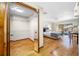 This bedroom offers a spacious closet, a ceiling fan, wood flooring, and a sliding glass door to the outside at 1906 Del Oro Ct, Dunedin, FL 34698