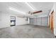 Spacious two-car garage providing ample parking and storage space with a convenient access door at 1906 Del Oro Ct, Dunedin, FL 34698