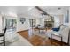 This comfortable living area is accented by hardwood floors and a stone fireplace for cozy gatherings at 1906 Del Oro Ct, Dunedin, FL 34698