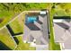 Home backyard with enclosed pool, green grass and privacy fence at 19730 Preservation Woods Dr, Lutz, FL 33558
