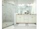 Bright bathroom with double vanity, shower, and modern finishes at 19730 Preservation Woods Dr, Lutz, FL 33558
