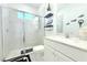 The bathroom boasts a glass-enclosed shower, modern fixtures, and decorative accents creating a spa-like atmosphere at 19730 Preservation Woods Dr, Lutz, FL 33558