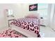 Cozy bedroom with playful pink decor, and ample natural light at 19730 Preservation Woods Dr, Lutz, FL 33558