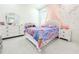 A whimsical bedroom features a mermaid theme, white furniture, and bright accents for a delightful space at 19730 Preservation Woods Dr, Lutz, FL 33558