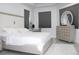 Serene main bedroom with large windows and neutral decor, creating a relaxing retreat at 19730 Preservation Woods Dr, Lutz, FL 33558