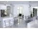 Bright and modern kitchen showcasing a kitchen island with bar stool seating and adjacent dining area at 19730 Preservation Woods Dr, Lutz, FL 33558
