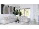 Modern living room with large sectional couch, decorative plant, and view of screened-in pool area at 19730 Preservation Woods Dr, Lutz, FL 33558