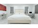 Comfortable main bedroom featuring a plush bed, accent lamps, and work space at 19730 Preservation Woods Dr, Lutz, FL 33558