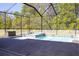 Inviting screened-in pool and spa with a spacious deck, offering a relaxing outdoor oasis at 19730 Preservation Woods Dr, Lutz, FL 33558