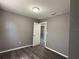 This bedroom features hardwood floors, neutral paint, and a white door at 203 D Street, Brooksville, FL 34601