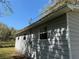 The home features lap siding, green grass, and several windows at 203 D Street, Brooksville, FL 34601