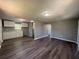 This home features a open-concept living space with modern dark floors and freshly painted walls at 203 D Street, Brooksville, FL 34601