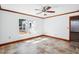 Bright bedroom with tiled floor, white walls and a large window at 2213 Spanish Vistas Dr, Dunedin, FL 34698
