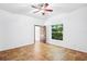 Bright, spacious bedroom with tiled floor, ceiling fan and bright window views at 2213 Spanish Vistas Dr, Dunedin, FL 34698