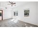 Bright bedroom with carpet flooring, sliding doors, and windows at 2213 Spanish Vistas Dr, Dunedin, FL 34698