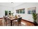 Dining room with a table, chairs, and a window overlooking the backyard at 2213 Spanish Vistas Dr, Dunedin, FL 34698