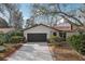 Charming single-Gathering home featuring a two-car garage, well-kept landscaping, and a cozy front entrance at 2213 Spanish Vistas Dr, Dunedin, FL 34698
