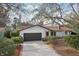 Charming single-Gathering home featuring a two-car garage, well-kept landscaping, and a cozy front entrance at 2213 Spanish Vistas Dr, Dunedin, FL 34698