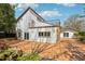 View of home's exterior including the balcony and outdoor entertaining area at 2213 Spanish Vistas Dr, Dunedin, FL 34698