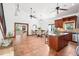 Staged kitchen with bar seating, stainless steel appliances, and dining area at 2213 Spanish Vistas Dr, Dunedin, FL 34698